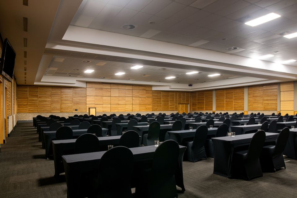 The plenary hall set up with rows of seating.